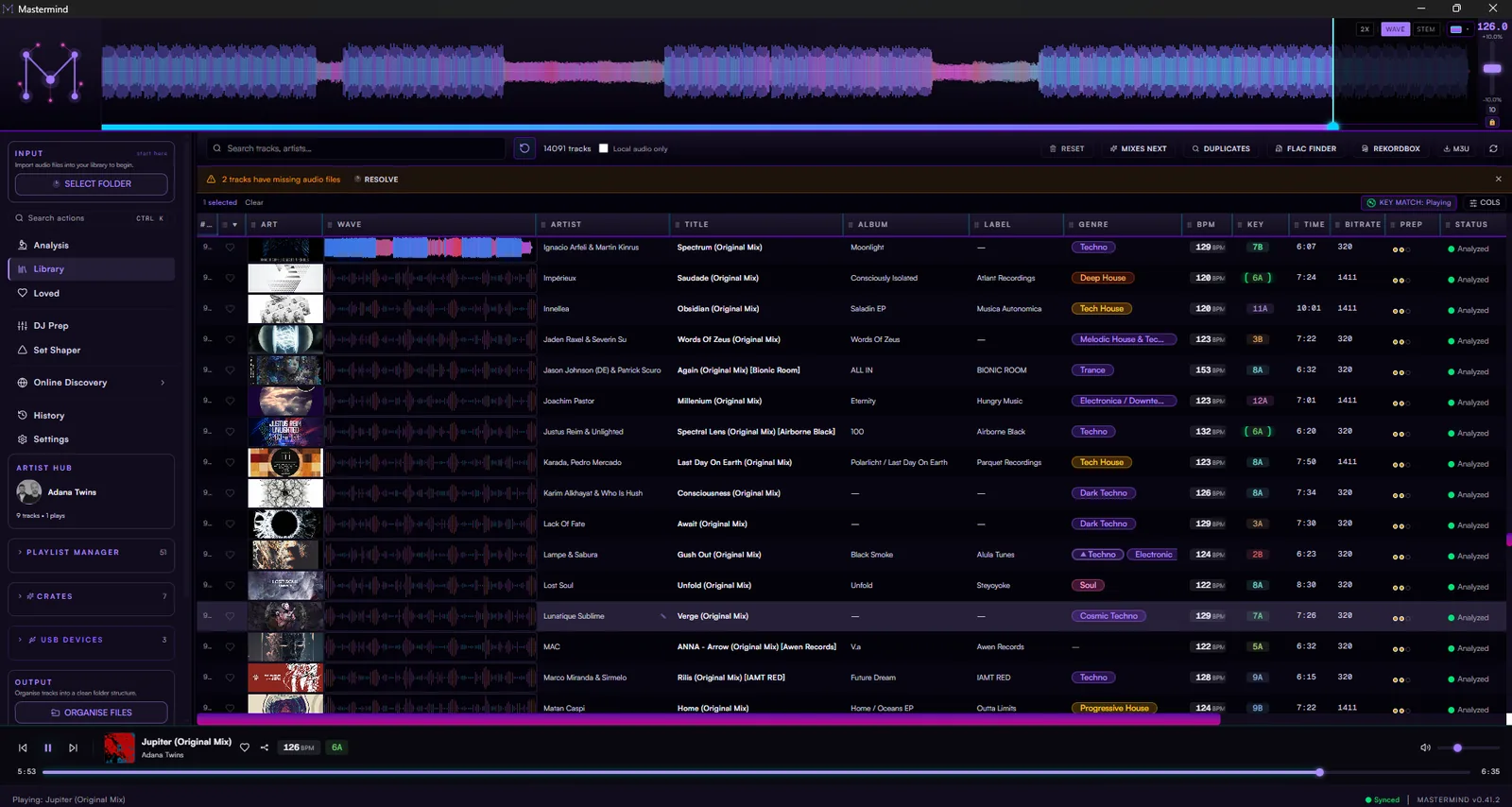 The Mastermind library — every track with its BPM, key, label and genre, and a colour waveform for the one that is playing